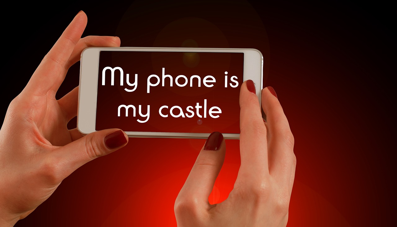cell phone that says "my phone is my castle" on the screen